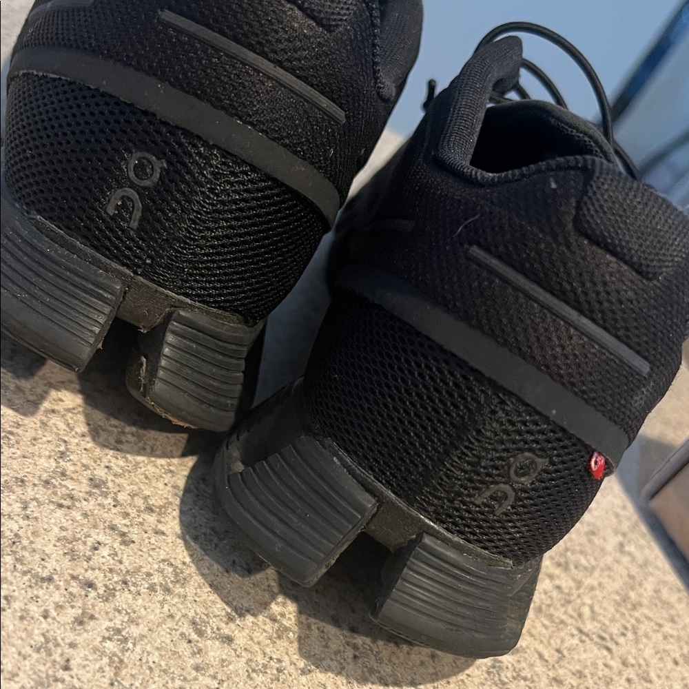 On Running All-Black Athletic Shoes